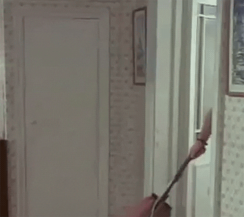 A GIF showing a fragment from the song 'I want to break free' from from Queen with Freddy Mercury vacuum cleaning.